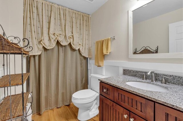 3122 Harmony Rd, Temple, GA 30179 - full bathroom with vanity, wood finished floors, and a shower with shower curtain