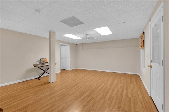 3122 Harmony Rd, Temple, GA 30179 - finished basement featuring light wood-style flooring, a drop ceiling, and a ceiling fan