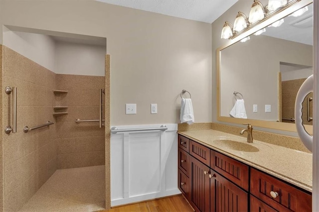 3122 Harmony Rd, Temple, GA 30179 - bathroom featuring vanity, a walk in shower, and wood finished floors