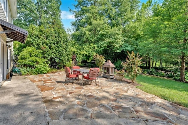 3122 Harmony Rd, Temple, GA 30179 - view of patio / terrace with outdoor dining area and view of wooded area