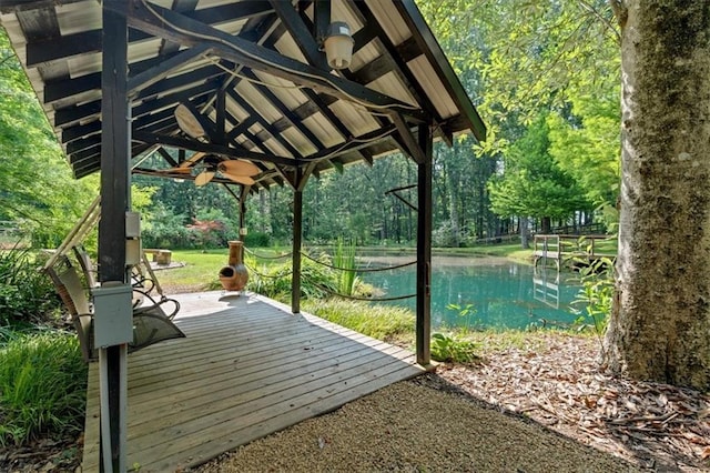 3122 Harmony Rd, Temple, GA 30179 - wooden terrace with a ceiling fan, a water view, a gazebo, and a swimming pool