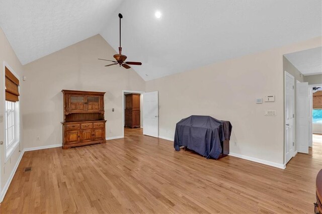 3122 Harmony Rd, Temple, GA 30179 - living room featuring ceiling fan, light wood-style flooring, and high vaulted ceiling