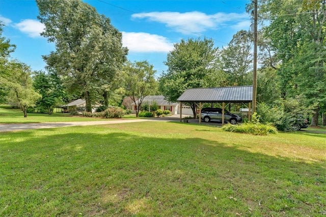 3122 Harmony Rd, Temple, GA 30179 - view of green lawn featuring a carport and view of scattered trees