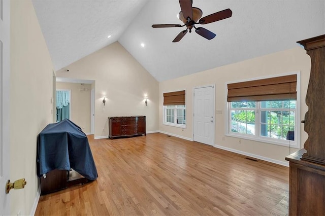 3122 Harmony Rd, Temple, GA 30179 - unfurnished living room with a ceiling fan, light wood finished floors, high vaulted ceiling, and recessed lighting