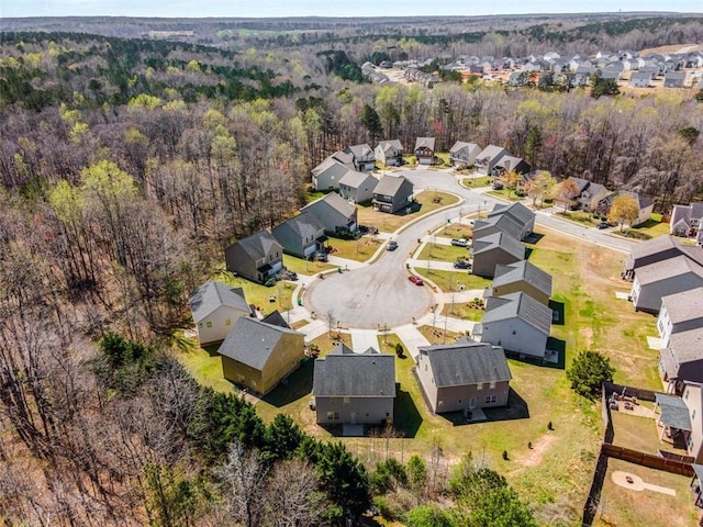 bird's eye view with a residential view and a view of trees