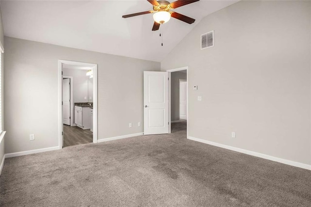 unfurnished bedroom with carpet flooring, ensuite bath, baseboards, and visible vents