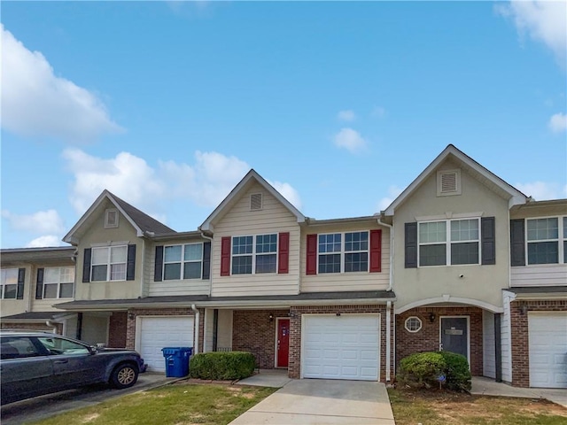 multi unit property featuring a garage