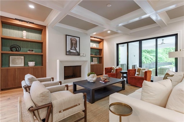 541 Londonberry Rd, Atlanta, GA 30327 - living room featuring light wood finished floors, a fireplace, coffered ceiling, beamed ceiling, and built in features