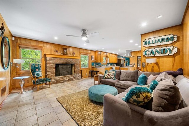 1138 Berkeley Rd, Avondale Estates, GA 30002 - living area featuring wooden walls, plenty of natural light, recessed lighting, a ceiling fan, and a fireplace