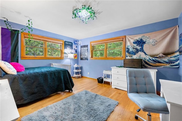 1138 Berkeley Rd, Avondale Estates, GA 30002 - bedroom with radiator, wood finished floors, and baseboards