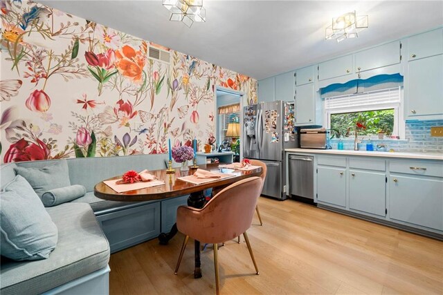 1138 Berkeley Rd, Avondale Estates, GA 30002 - dining room with wallpapered walls and light wood finished floors