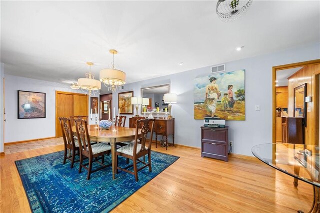 1138 Berkeley Rd, Avondale Estates, GA 30002 - dining space featuring a chandelier, wood finished floors, and baseboards