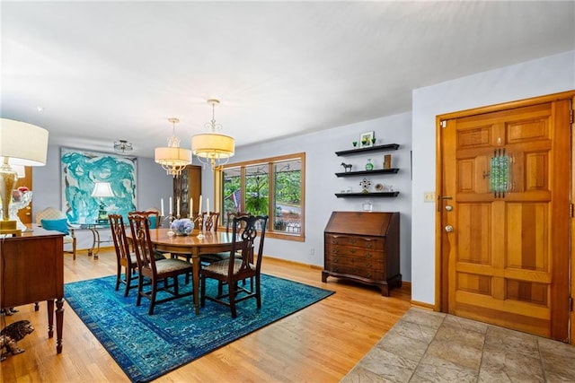 1138 Berkeley Rd, Avondale Estates, GA 30002 - dining space with a chandelier, wood finished floors, and baseboards