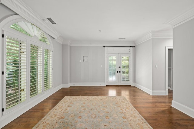 entrance foyer featuring french doors, crown molding, and dark hardwood / wood-style flooring