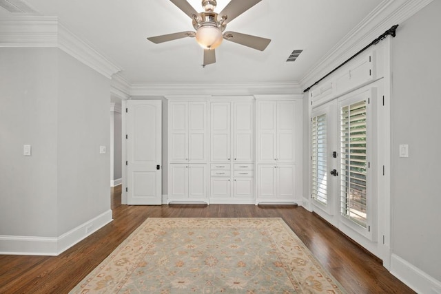 unfurnished bedroom with crown molding, dark wood-type flooring, access to exterior, and ceiling fan