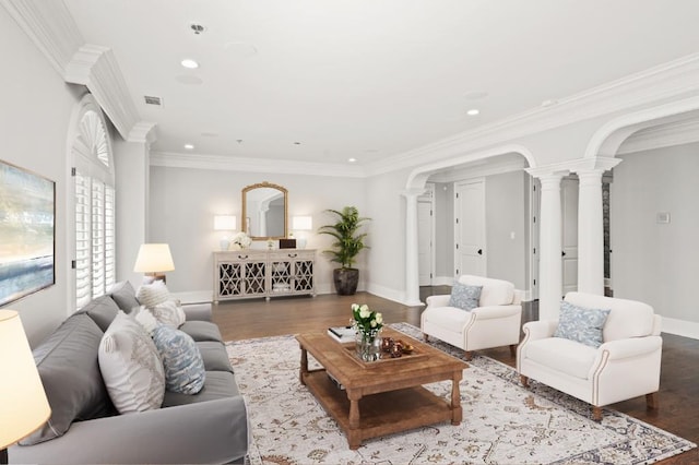 living room featuring crown molding, hardwood / wood-style flooring, and ornate columns