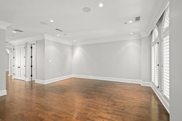 unfurnished room featuring crown molding, dark hardwood / wood-style flooring, and french doors