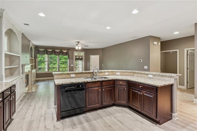 328 Shade Tree Cir, Woodstock, GA 30188 - kitchen featuring black dishwasher, light wood-style flooring, a ceiling fan, dark brown cabinetry, and light stone countertops