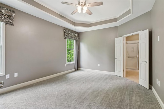 328 Shade Tree Cir, Woodstock, GA 30188 - spare room featuring ornamental molding, ceiling fan, a tray ceiling, and carpet