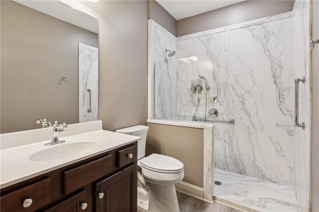 328 Shade Tree Cir, Woodstock, GA 30188 - full bath with vanity, a marble finish shower, and wood finished floors