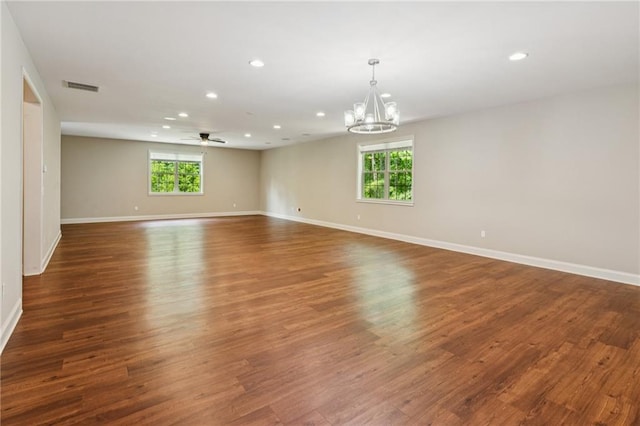 328 Shade Tree Cir, Woodstock, GA 30188 - unfurnished room featuring recessed lighting, plenty of natural light, a chandelier, wood finished floors, and a ceiling fan