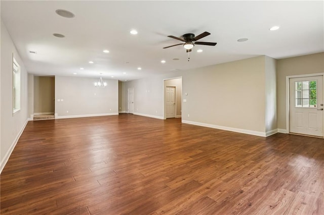 328 Shade Tree Cir, Woodstock, GA 30188 - unfurnished living room with a chandelier, ceiling fan, recessed lighting, and wood finished floors