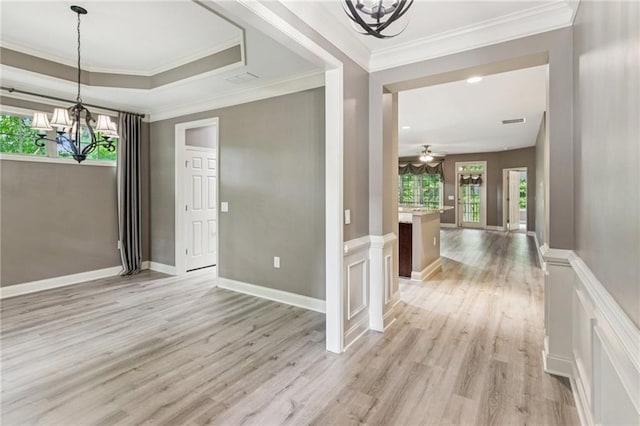 328 Shade Tree Cir, Woodstock, GA 30188 - unfurnished dining area with a chandelier, light wood-style floors, ornamental molding, and ceiling fan