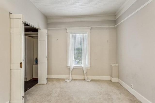 unfurnished bedroom featuring light carpet