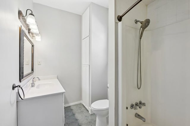 full bathroom featuring shower / bathtub combination, toilet, vanity, baseboards, and tile patterned floors