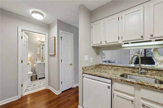 300 Johnson Ferry Rd NE Unit A313, Atlanta, GA 30328 - kitchen with dishwasher, dark wood-style floors, white cabinets, and light stone countertops