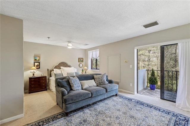 300 Johnson Ferry Rd NE Unit A313, Atlanta, GA 30328 - carpeted bedroom featuring access to exterior, a textured ceiling, and a ceiling fan