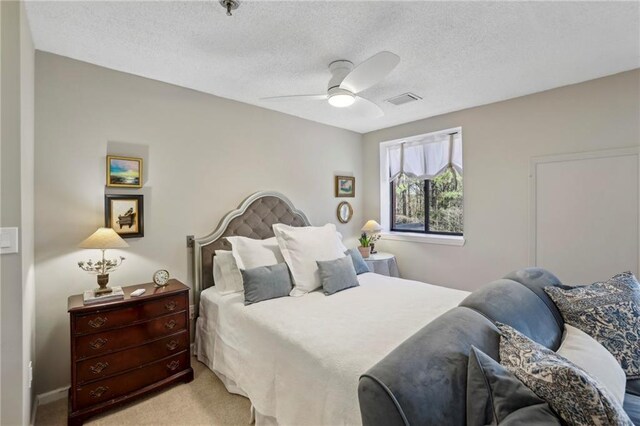 300 Johnson Ferry Rd NE Unit A313, Atlanta, GA 30328 - bedroom featuring a textured ceiling, light colored carpet, and ceiling fan