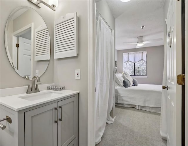 300 Johnson Ferry Rd NE Unit A313, Atlanta, GA 30328 - ensuite bathroom with vanity, ceiling fan, and a textured ceiling