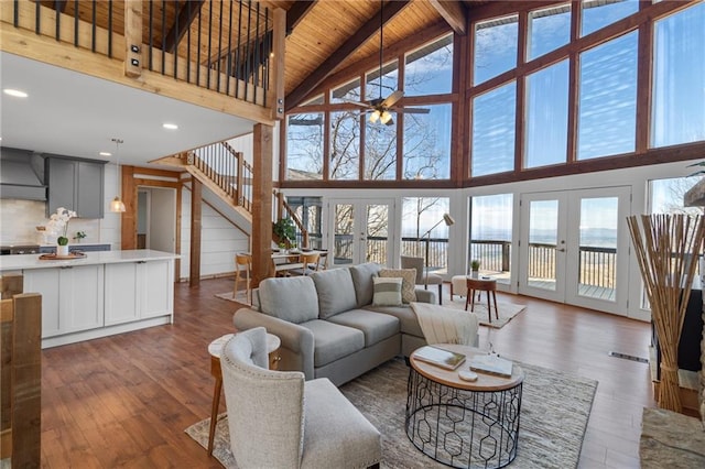 living area featuring wooden ceiling, dark wood-style floors, and french doors