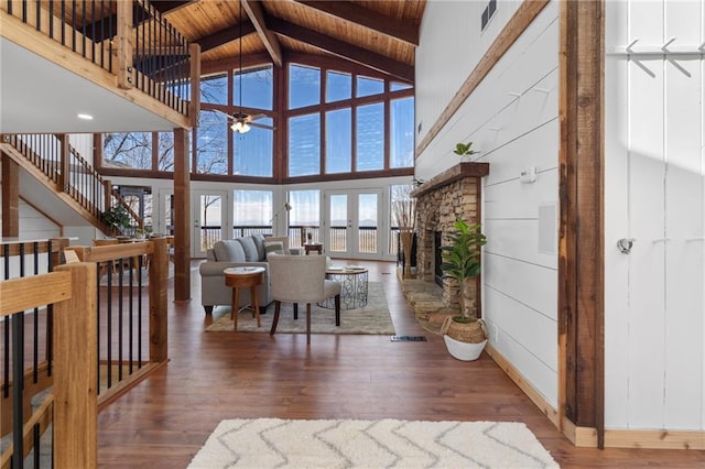 living room featuring wood ceiling, visible vents, and wood finished floors