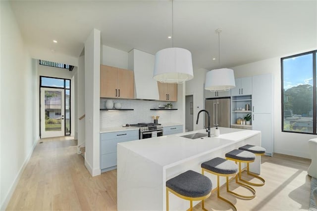 816 Berne St Unit 6, Atlanta, GA 30316 - kitchen with stainless steel appliances, a sink, healthy amount of natural light, light wood finished floors, and recessed lighting