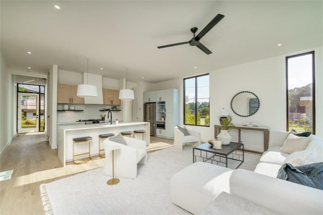 816 Berne St Unit 6, Atlanta, GA 30316 - living room featuring light wood-style flooring, a ceiling fan, and recessed lighting