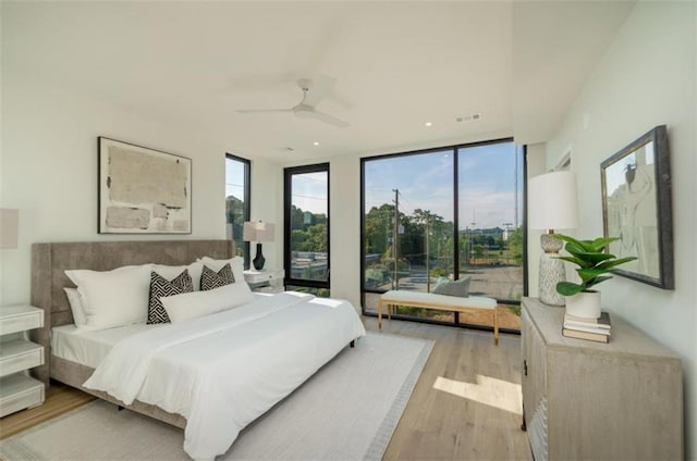 816 Berne St Unit 6, Atlanta, GA 30316 - bedroom featuring wood finished floors, expansive windows, access to outside, and a ceiling fan