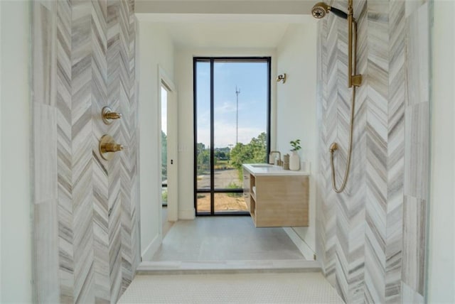 816 Berne St Unit 6, Atlanta, GA 30316 - bathroom featuring vanity, a shower, tile patterned flooring, and baseboards