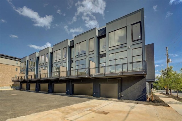 816 Berne St Unit 6, Atlanta, GA 30316 - view of building exterior featuring driveway and a garage
