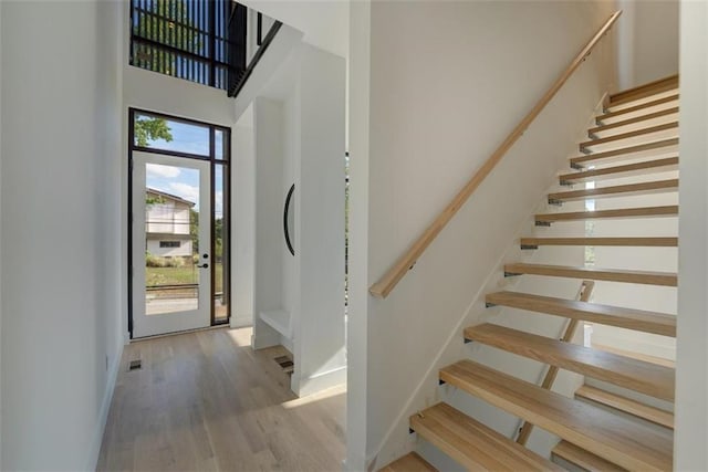 816 Berne St Unit 6, Atlanta, GA 30316 - foyer featuring stairs, wood finished floors, baseboards, and a high ceiling
