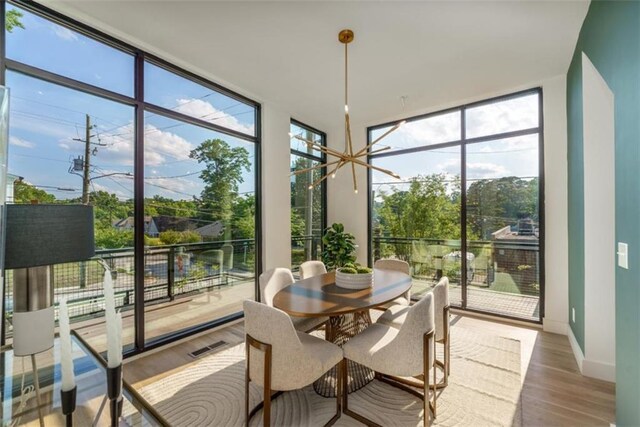 816 Berne St Unit 6, Atlanta, GA 30316 - sunroom with floor to ceiling windows, plenty of natural light, wood finished floors, and baseboards