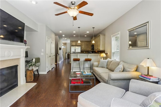 7275 Highland Blf Unit 8, Atlanta, GA 30328 - living room featuring ceiling fan, dark wood finished floors, recessed lighting, and a fireplace