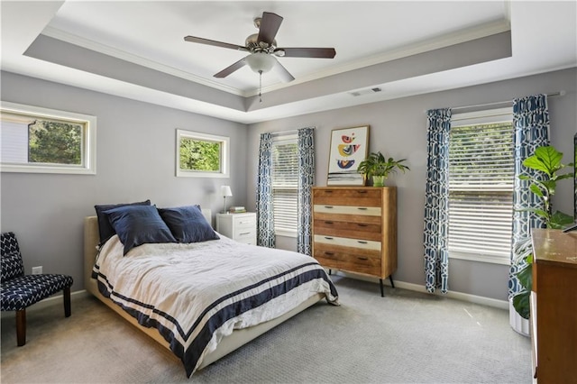 7275 Highland Blf Unit 8, Atlanta, GA 30328 - bedroom featuring a tray ceiling, ornamental molding, light colored carpet, and a ceiling fan