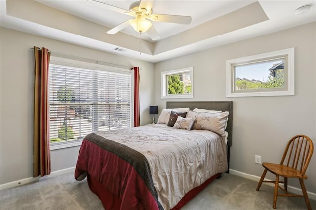 7275 Highland Blf Unit 8, Atlanta, GA 30328 - carpeted bedroom with multiple windows, a raised ceiling, and a ceiling fan
