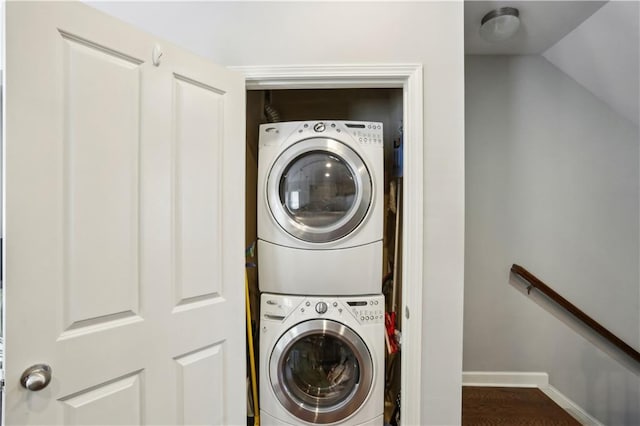 7275 Highland Blf Unit 8, Atlanta, GA 30328 - laundry area with stacked washing machine and dryer and wood finished floors