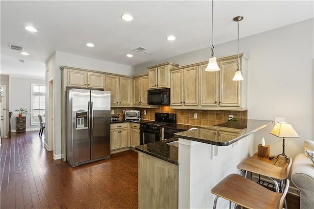 7275 Highland Blf Unit 8, Atlanta, GA 30328 - kitchen featuring black appliances, a peninsula, tasteful backsplash, dark stone countertops, and dark wood-style floors