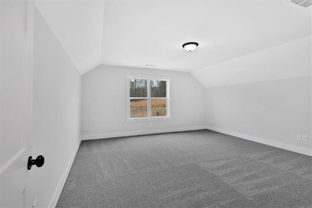 bonus room featuring lofted ceiling, baseboards, visible vents, and carpet