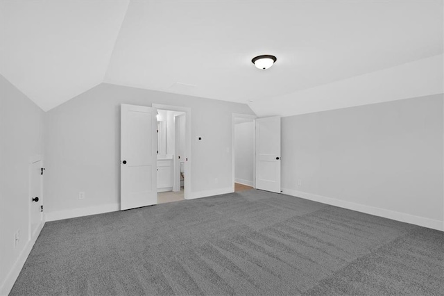 bonus room featuring carpet flooring, vaulted ceiling, and baseboards