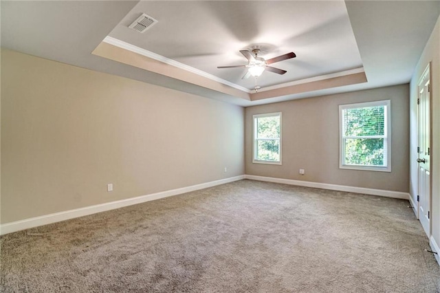 1858 Belmore St SE, Smyrna, GA 30080 - carpeted spare room featuring a tray ceiling, ceiling fan, and crown molding